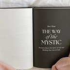 An open book resting on white linen